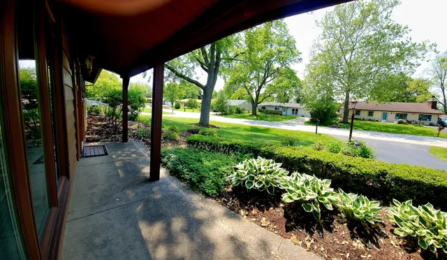 a view of a garden with patio