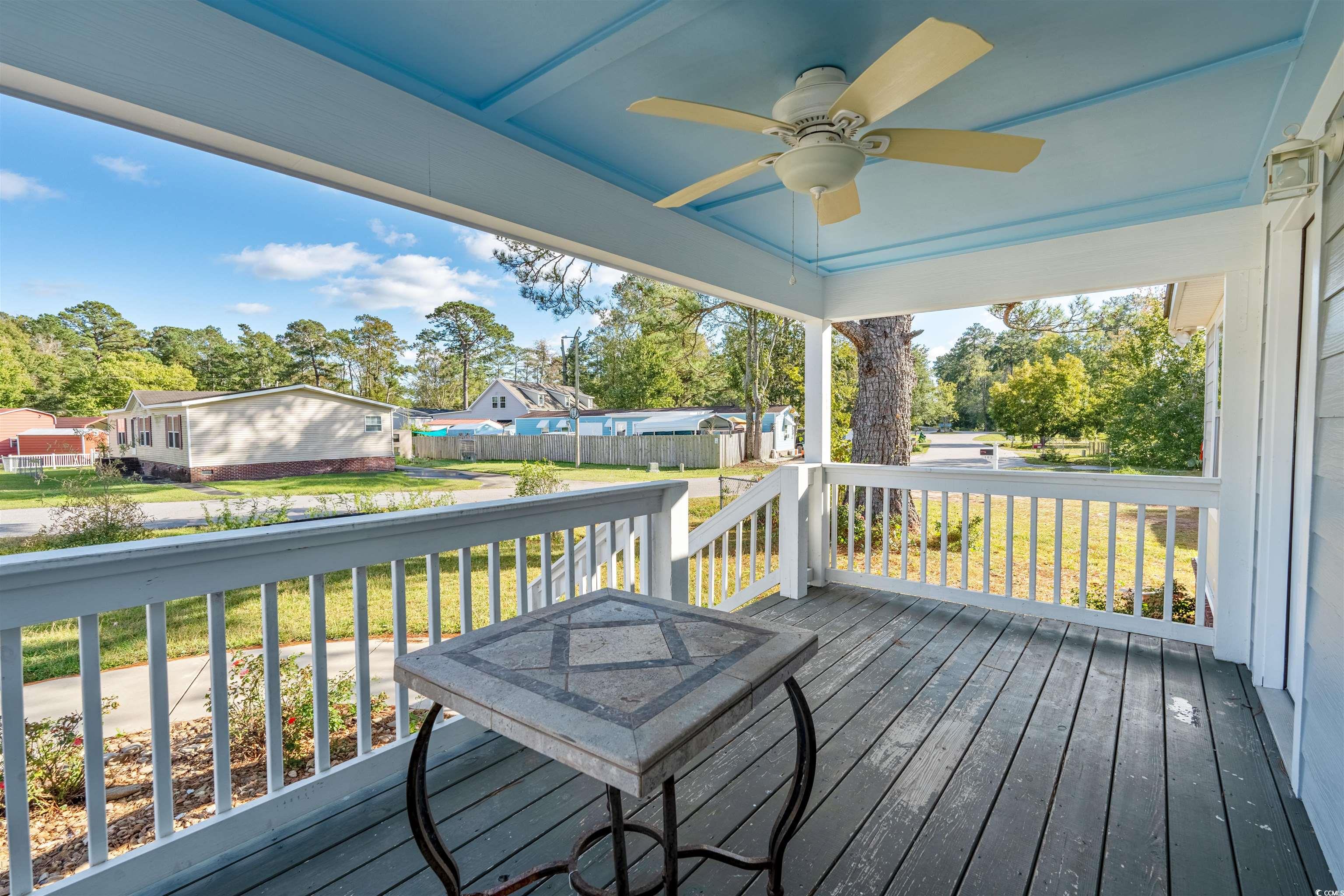 107 Ranchette Circle Myrtle Beach, SC 29588 - Photo 4 of 20 Deck featuring ceiling fan and a yard