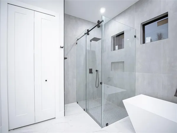 a bathroom with a shower and a toilet