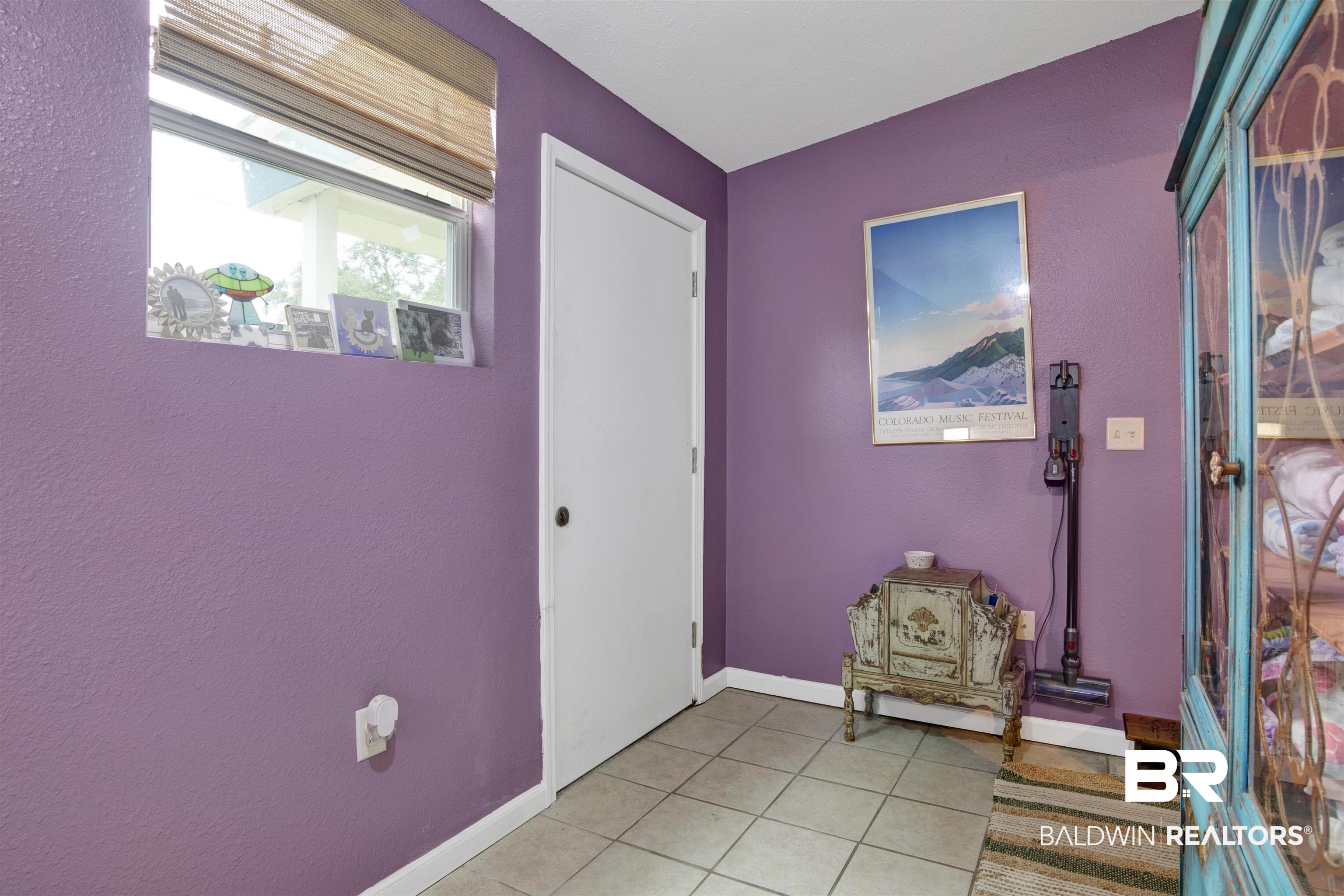 1100 North Pine Street Foley, AL 36535 - Photo 21 of 30 Tile flooring and light purple wall finish