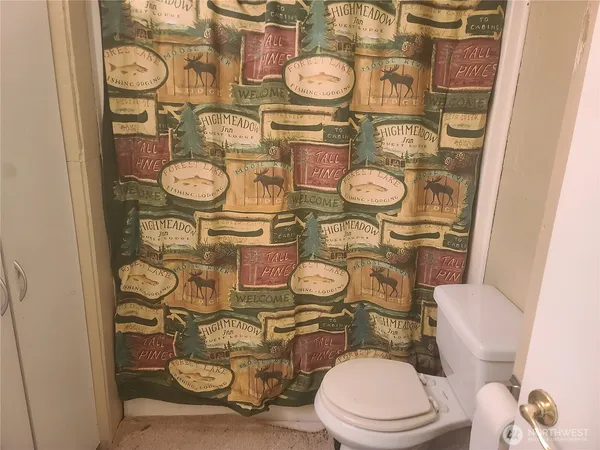a view of room with window and hardwood floor