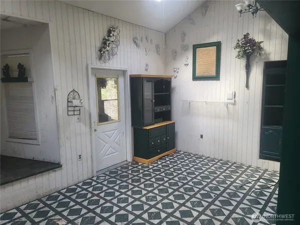 a view of a storage & utility room with closet