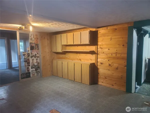 a kitchen with a sink cabinets and window