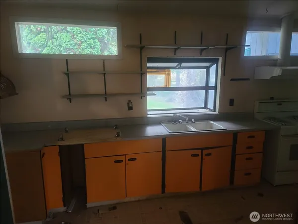 a bathroom with double vanity and a sink