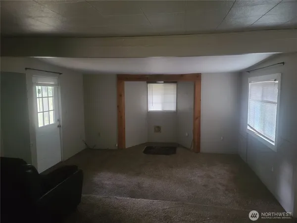 a kitchen with a sink and a refrigerator