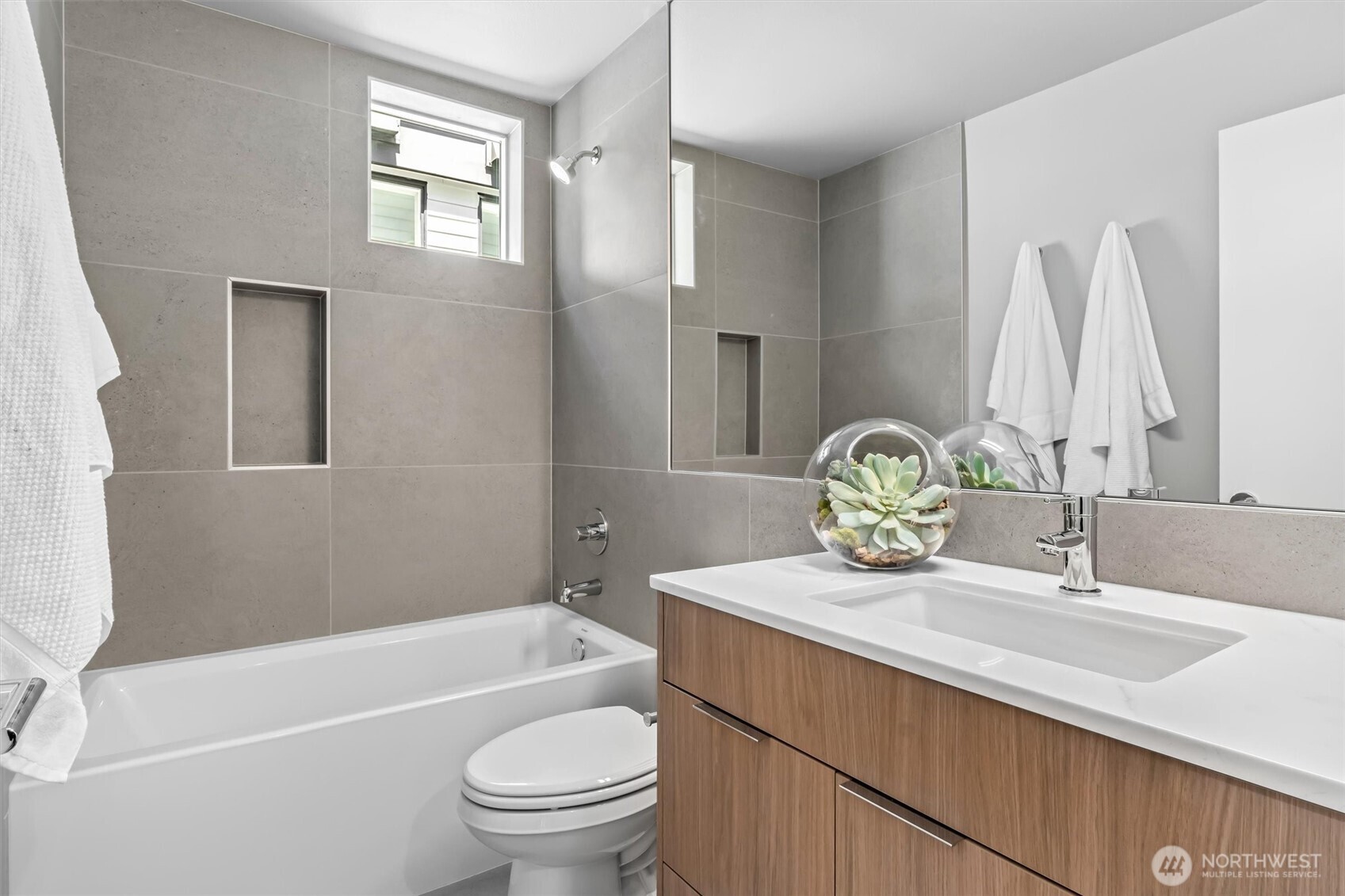 4460 Midvale Avenue North Seattle, WA 98103 - Photo 24 of 40 a bathroom with a sink a toilet and shower