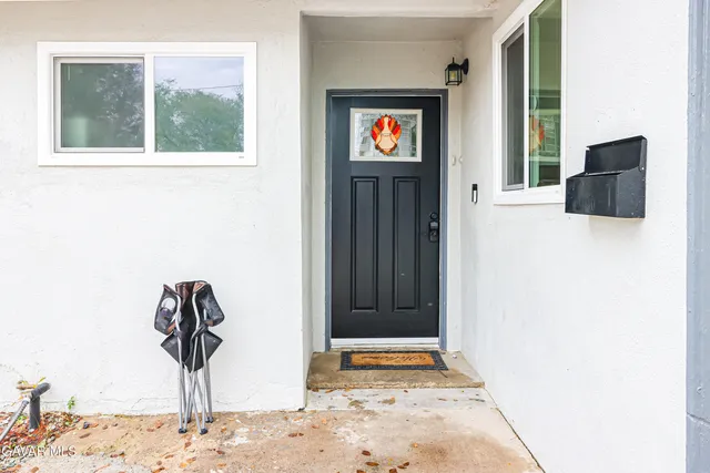 a view of a entryway door front of a house