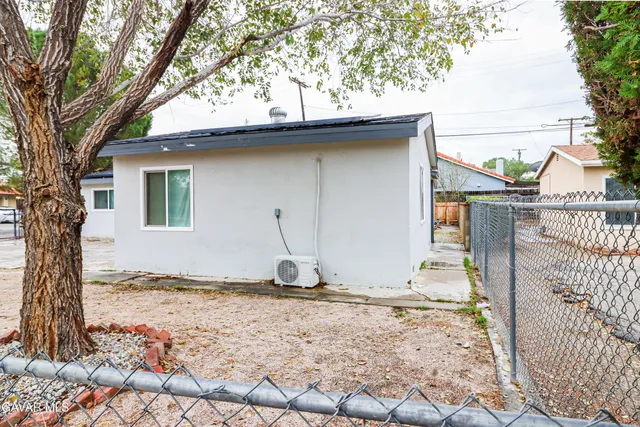a house with trees in the background