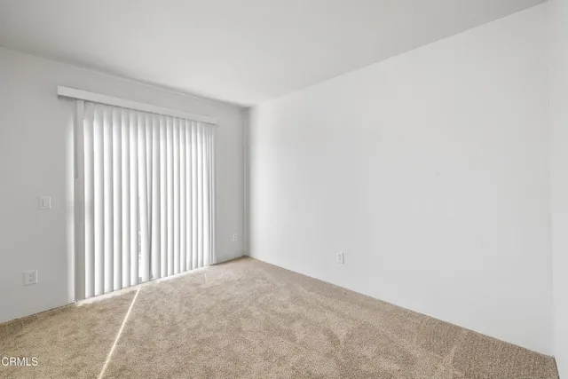 a view of a livingroom with a wooden & door