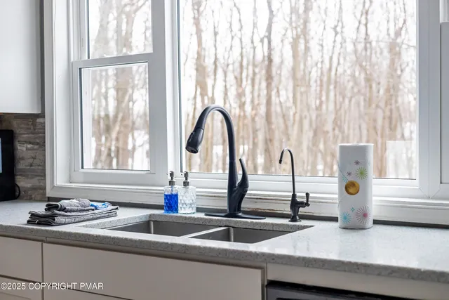 a spacious bedroom with a bed and a window