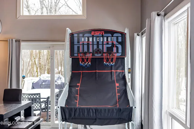 a bedroom with a bed and closet with mirror