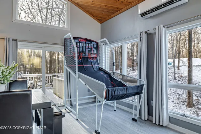 a bedroom with a bed and a lamp on desk