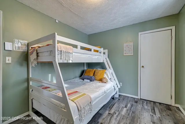 a view of a chairs and tables in the back yard of the house