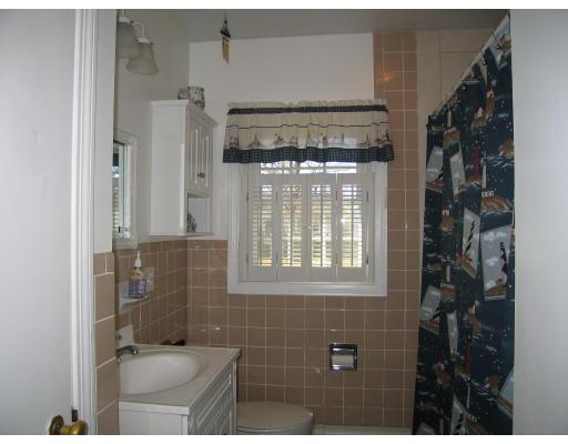 31 Melba Street Springfield, MA 01119 - Photo 13 of 14 a bathroom with a toilet a sink and shower