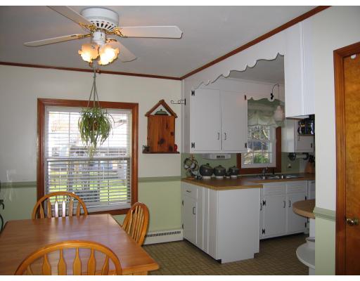 31 Melba Street Springfield, MA 01119 - Photo 9 of 14 a kitchen with a stove a refrigerator and chandelier