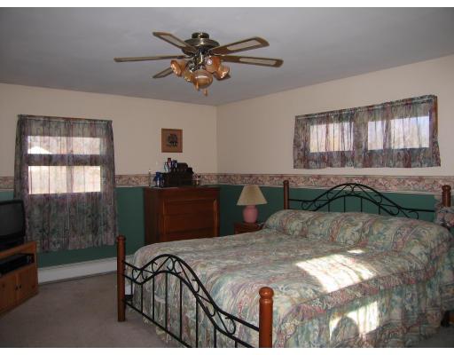 31 Melba Street Springfield, MA 01119 - Photo 10 of 14 a bed sitting in a bedroom next to a window
