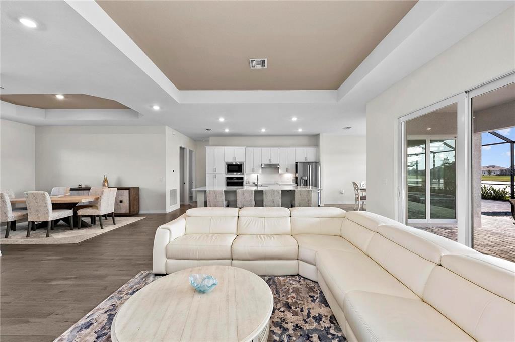 17341 Sandpearl Road Venice, FL 34293 - Photo 12 of 95 a large bedroom with a large bed and glass windows