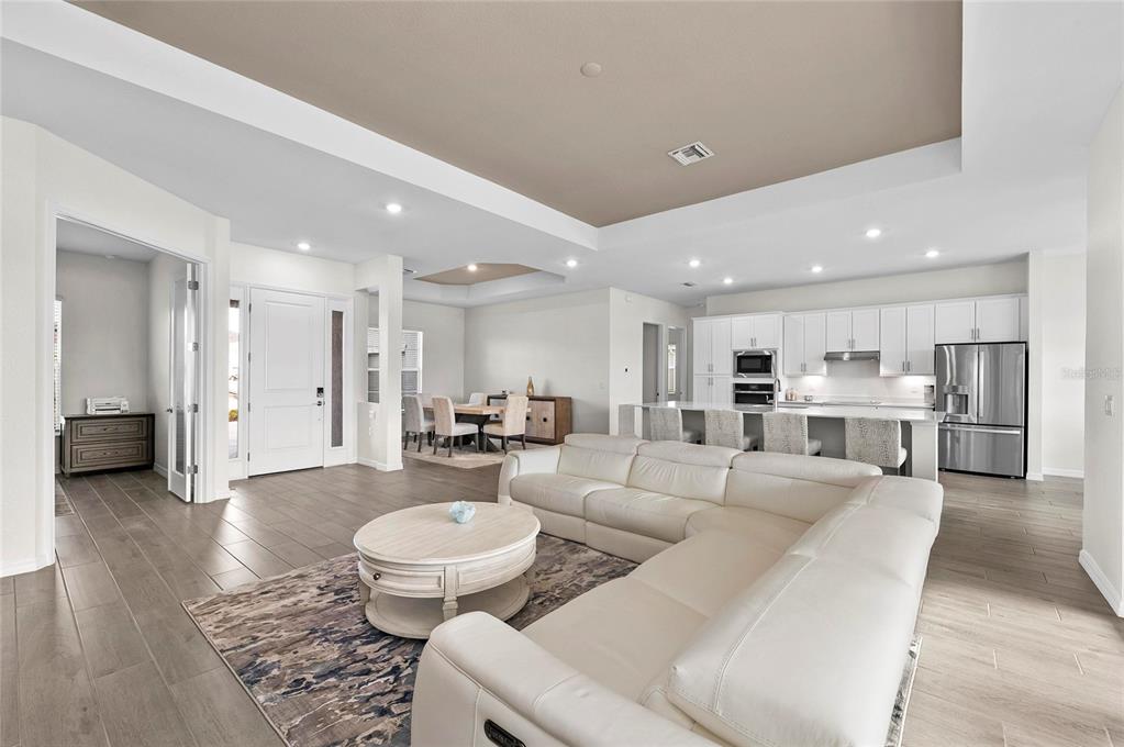 17341 Sandpearl Road Venice, FL 34293 - Photo 13 of 95 a living room with furniture and a view of kitchen