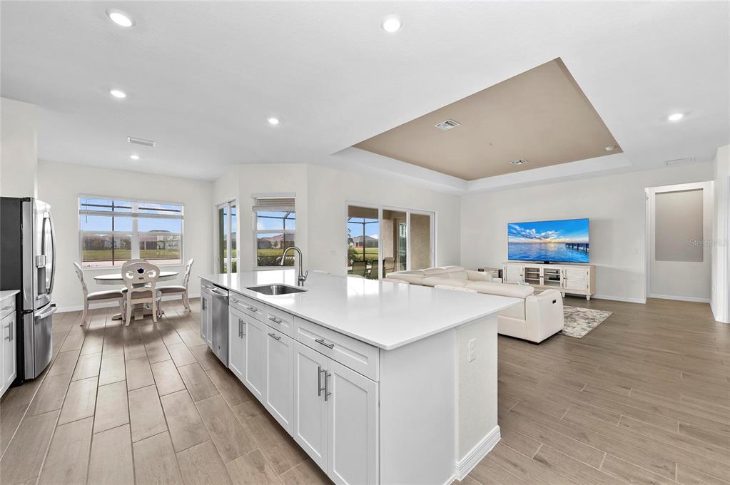 17341 Sandpearl Road Venice, FL 34293 - Photo 20 of 95 a large white kitchen with a large window