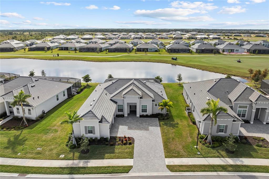 17341 Sandpearl Road Venice, FL 34293 - Photo 2 of 95 an aerial view of a house with a big yard