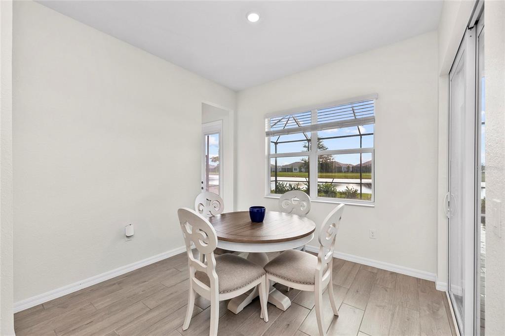 17341 Sandpearl Road Venice, FL 34293 - Photo 22 of 95 a dining room with furniture and window