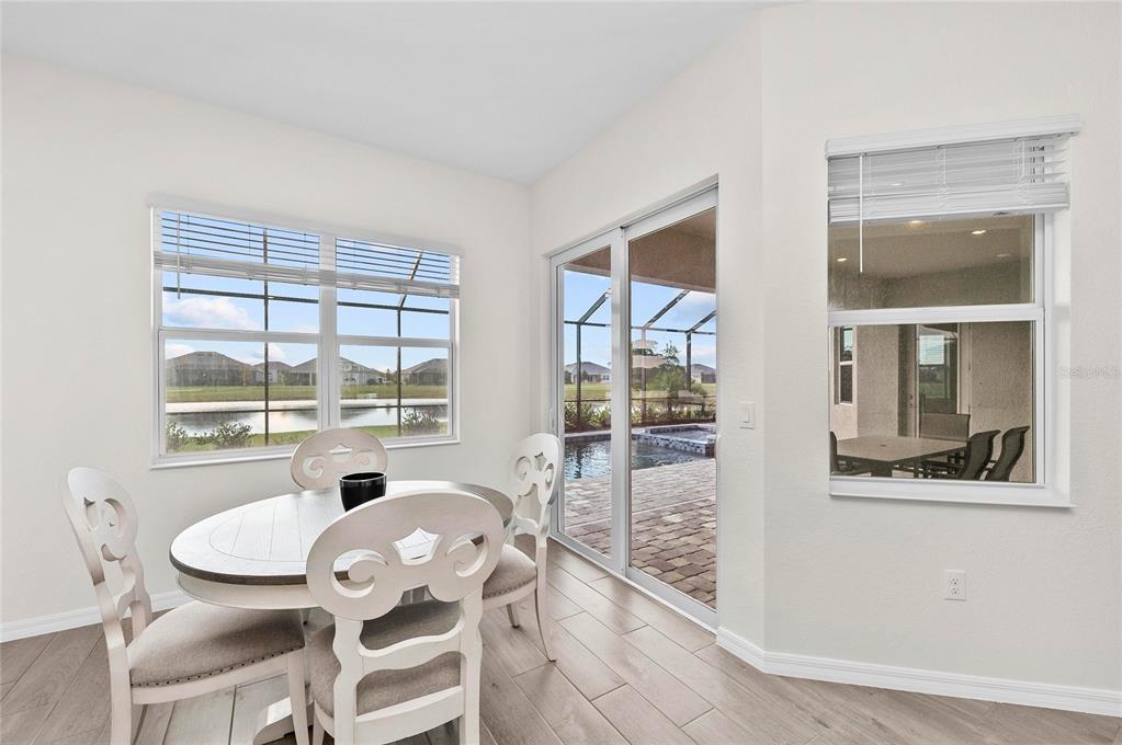 17341 Sandpearl Road Venice, FL 34293 - Photo 23 of 95 a dining room with furniture and window