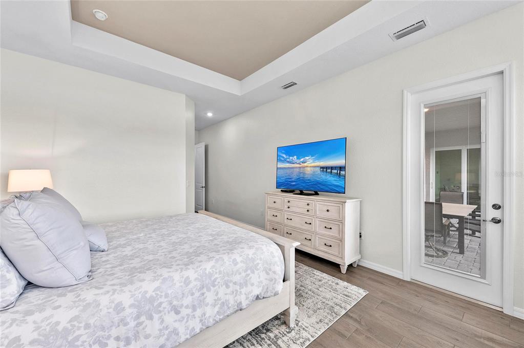 17341 Sandpearl Road Venice, FL 34293 - Photo 28 of 95 a bedroom with a bed and a window