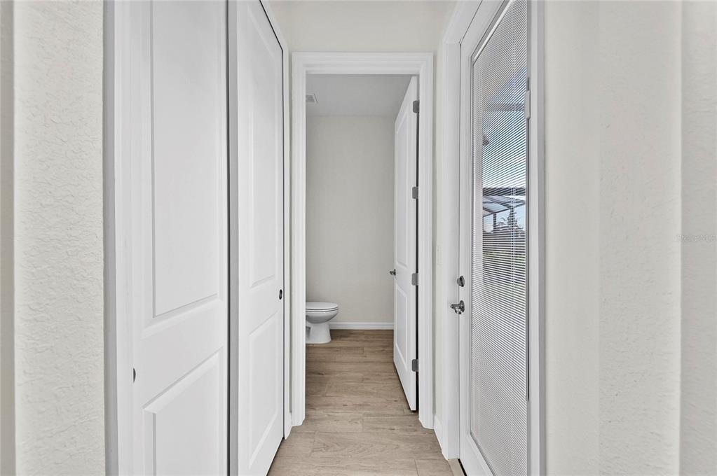 17341 Sandpearl Road Venice, FL 34293 - Photo 45 of 95 a view of a bathroom from a hallway