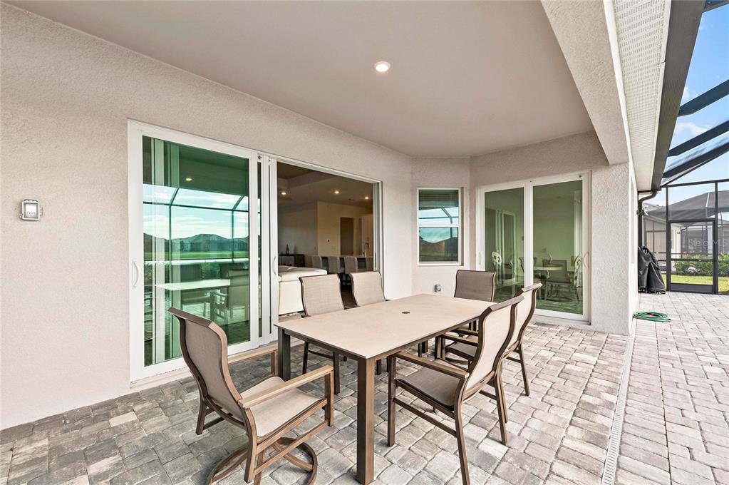 17341 Sandpearl Road Venice, FL 34293 - Photo 51 of 95 a view of a dining room with furniture window and wooden floor