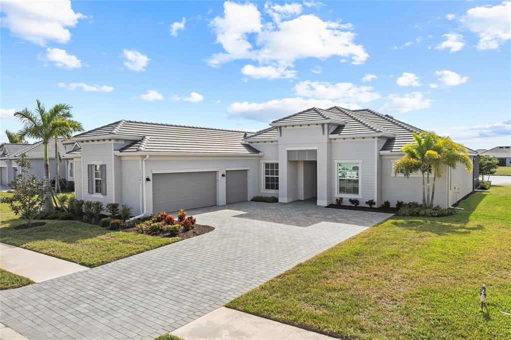 17341 Sandpearl Road Venice, FL 34293 - Photo 66 of 95 a view of a house with a patio