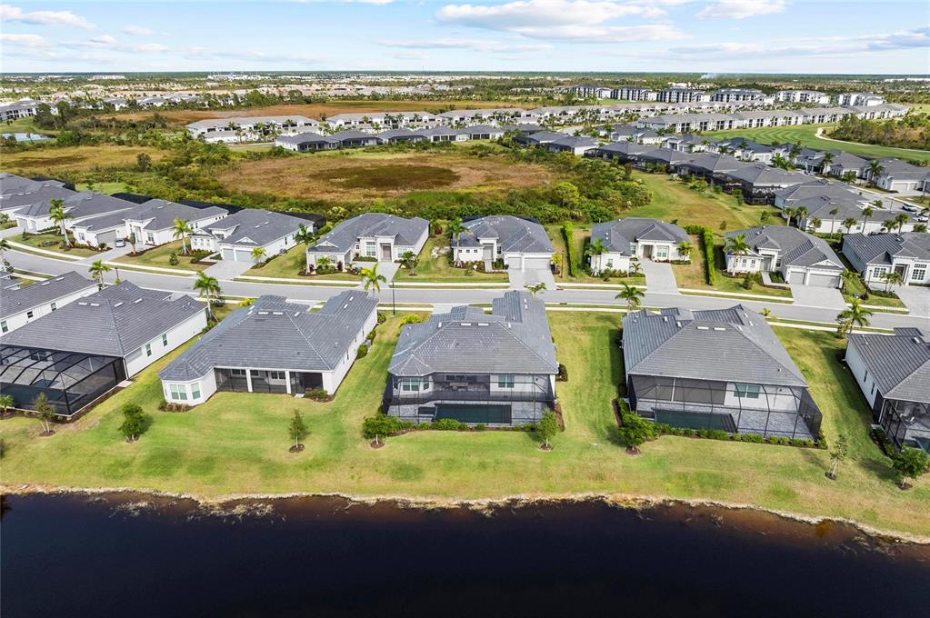 17341 Sandpearl Road Venice, FL 34293 - Photo 70 of 95 an aerial view of residential houses with outdoor space