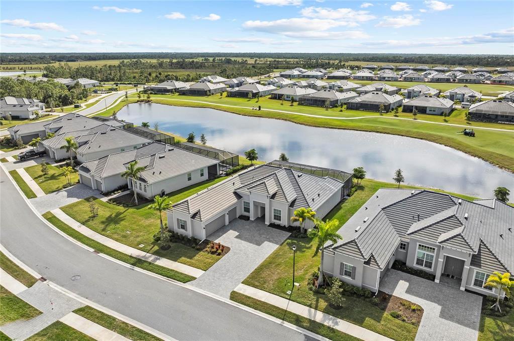 17341 Sandpearl Road Venice, FL 34293 - Photo 71 of 95 an aerial view of residential houses with outdoor space and ocean view