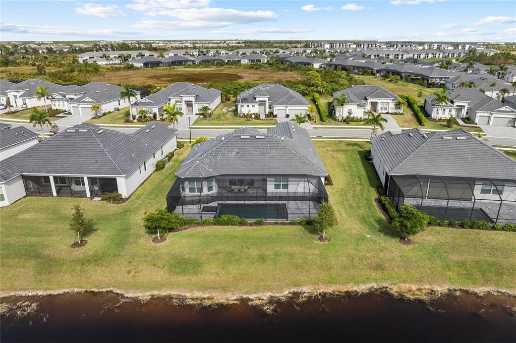 17341 Sandpearl Road Venice, FL 34293 - Photo 73 of 95 an aerial view of residential houses with outdoor space and swimming pool