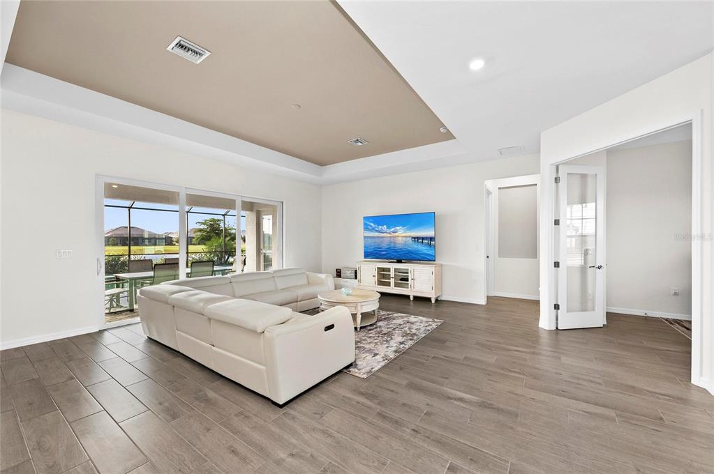 17341 Sandpearl Road Venice, FL 34293 - Photo 10 of 95 a living room with furniture and a large window