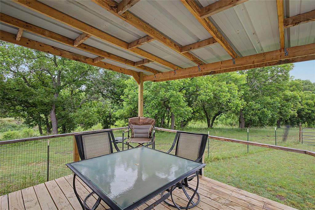 6065 Timber Trail Azle, TX 76020 - Photo 5 of 33 a view of a patio with a table