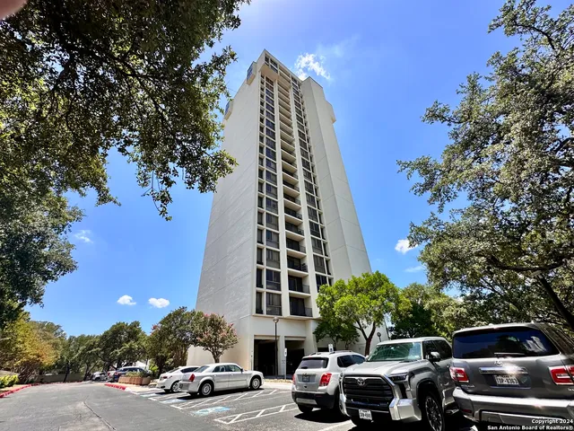 a cars parked in front of a building