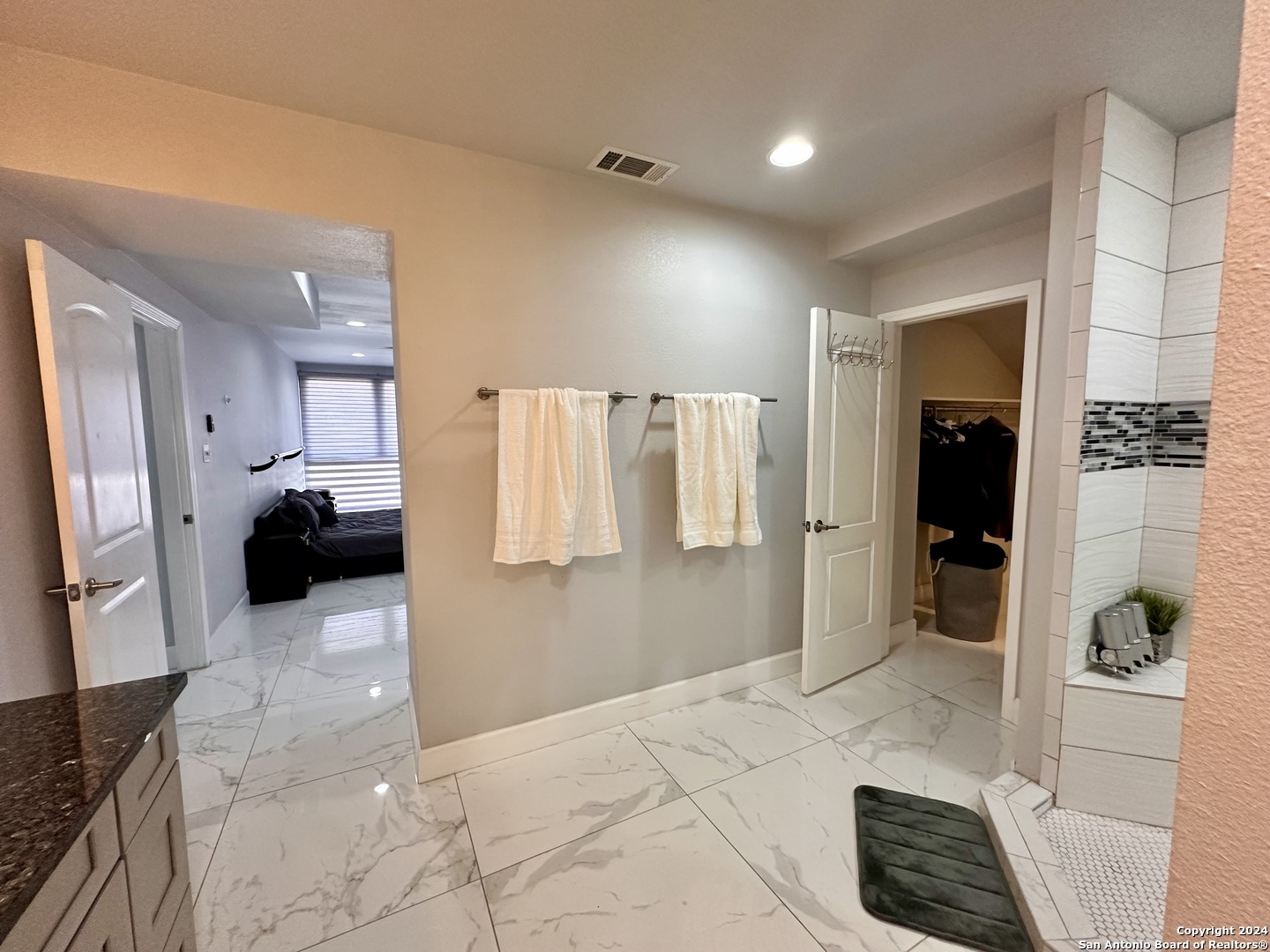 7701 Wurzbach Road, Unit 2301 San Antonio, TX 78229 - Photo 17 of 36 a bathroom with a bathtub and a shower