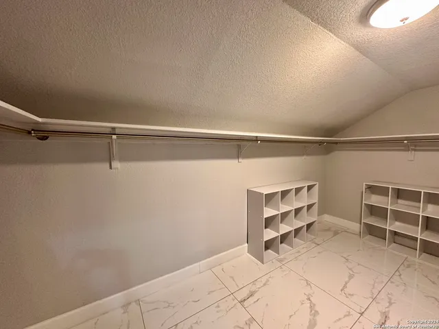a view of an empty walk in closet