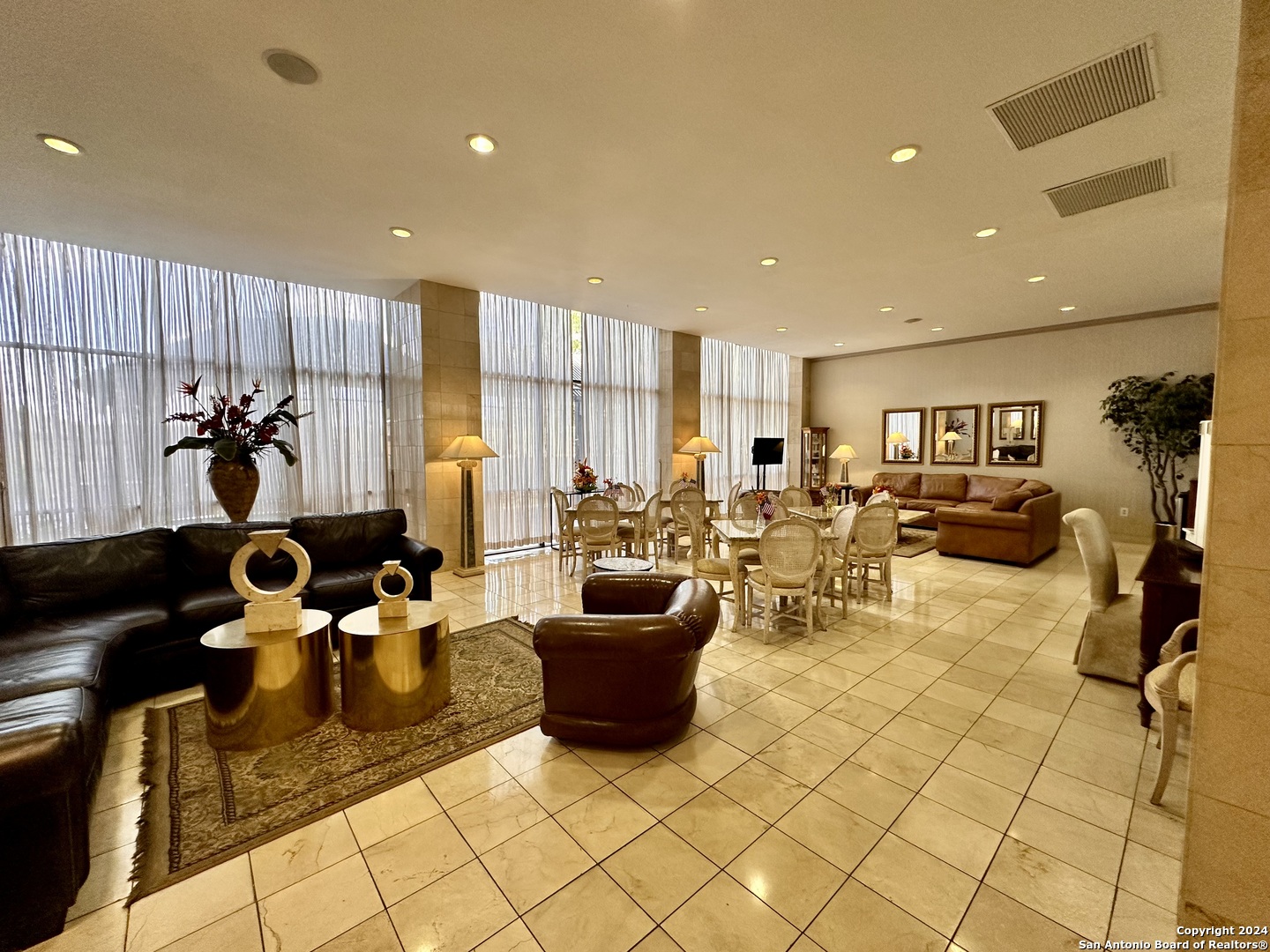 7701 Wurzbach Road, Unit 2301 San Antonio, TX 78229 - Photo 24 of 36 a living room with lots of furniture and a view of living room