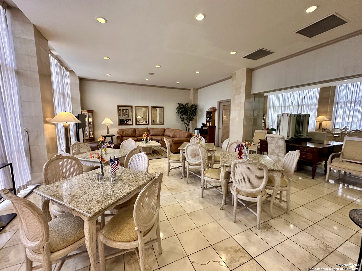 7701 Wurzbach Road, Unit 2301 San Antonio, TX 78229 - Photo 25 of 36 a living room with lots of furniture and a table