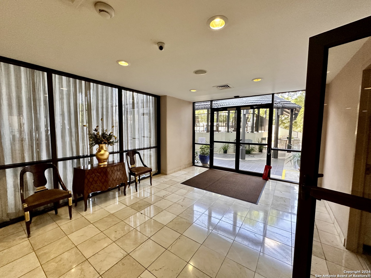 7701 Wurzbach Road, Unit 2301 San Antonio, TX 78229 - Photo 26 of 36 a view of an empty room with large window and furniture