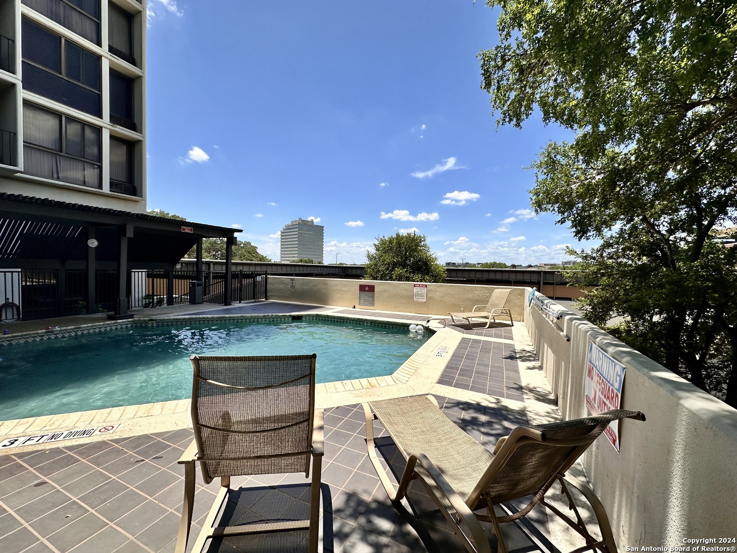 7701 Wurzbach Road, Unit 2301 San Antonio, TX 78229 - Photo 29 of 36 a view of a patio with table and chairs with barbeque grill and plants