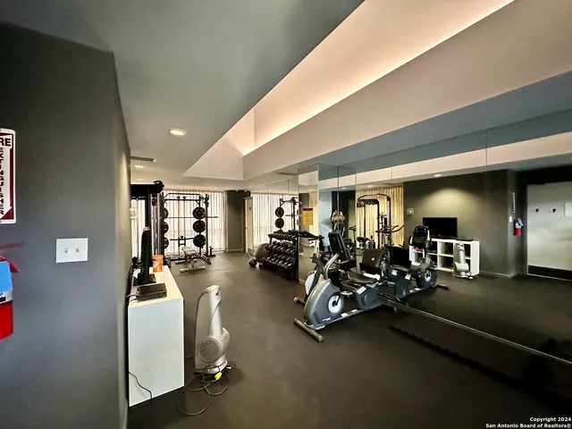 a kitchen with a large window and a stove top oven