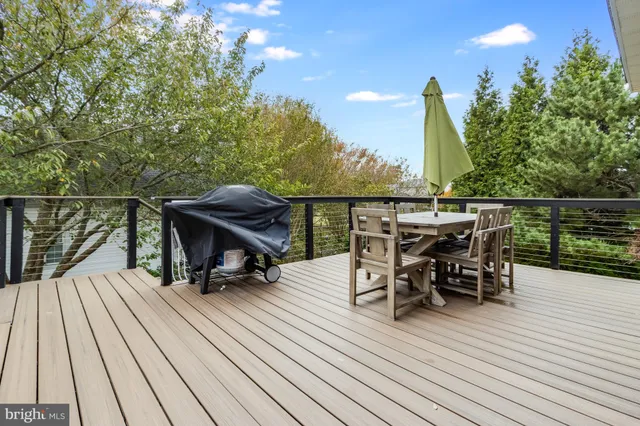 a bathroom with a sink a toilet and shower curtain