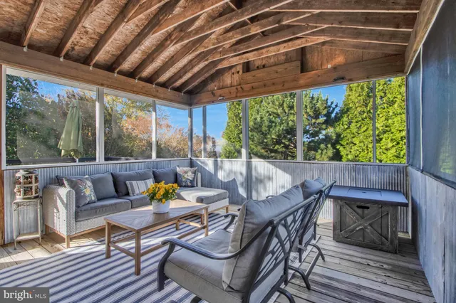 a bathroom with a toilet sink vanity and mirror