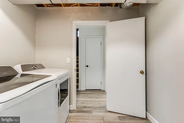 a bedroom with a bed and a ceiling fan