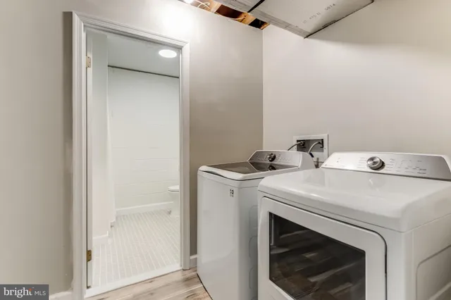 a bedroom with a large bed and a tv