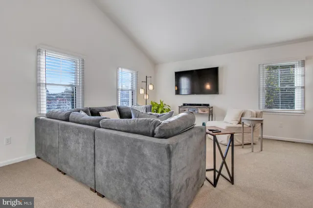 a bedroom with a bed and flowerpot