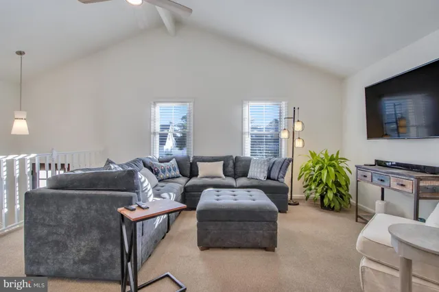 a bedroom with a bed and a lamp