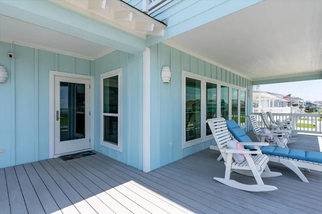 a kitchen with stainless steel appliances granite countertop a table chairs stove and refrigerator